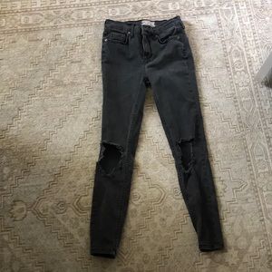 Black jeans with hole in knees